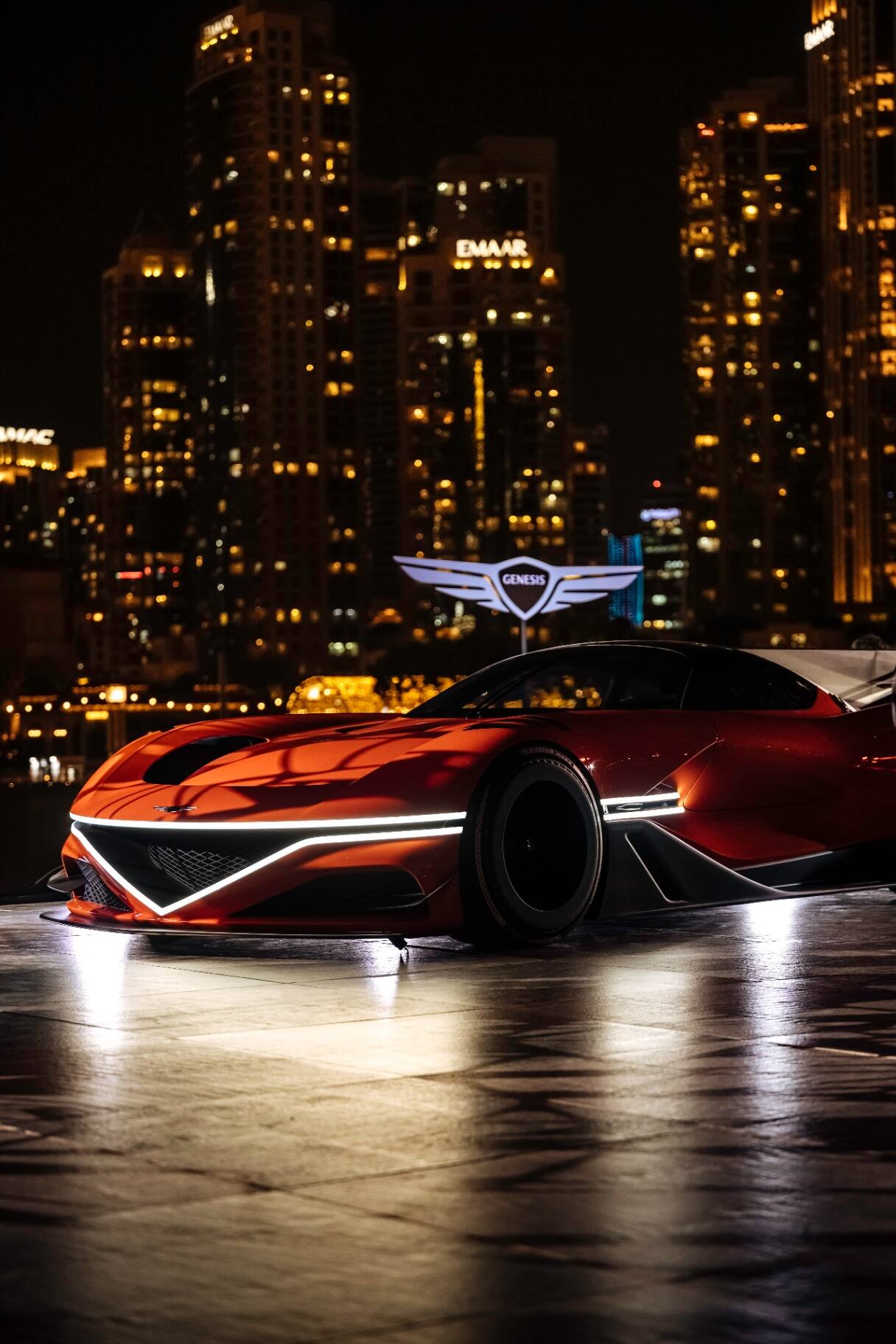 Genesis concept car against Dubai skyline